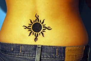 Tribal Sun Tattoo Design on Lower Back Picture