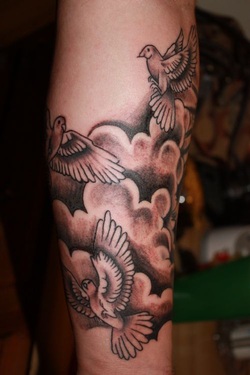 Dove in Clouds Tattoo Design Picture