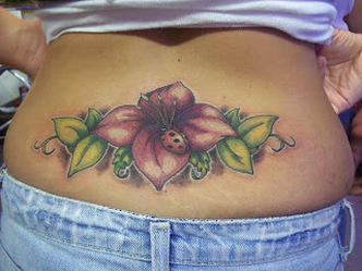 Lower Back Flower and Leaves Tattoo Design Picture