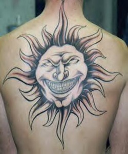 Evil Tribal Sun Tattoo Design Picture