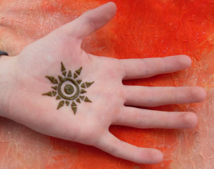 Tribal Sun Tattoo Design on Hand Picture
