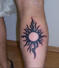 Tribal Sun Tattoo Design on Leg Picture